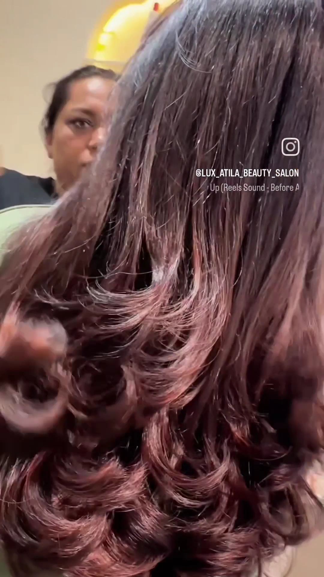 Glossy burgundy curls finished at Lux Atila