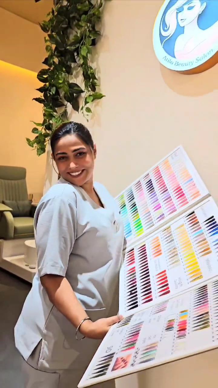 A Lux Atila stylist presenting the hair colour chart